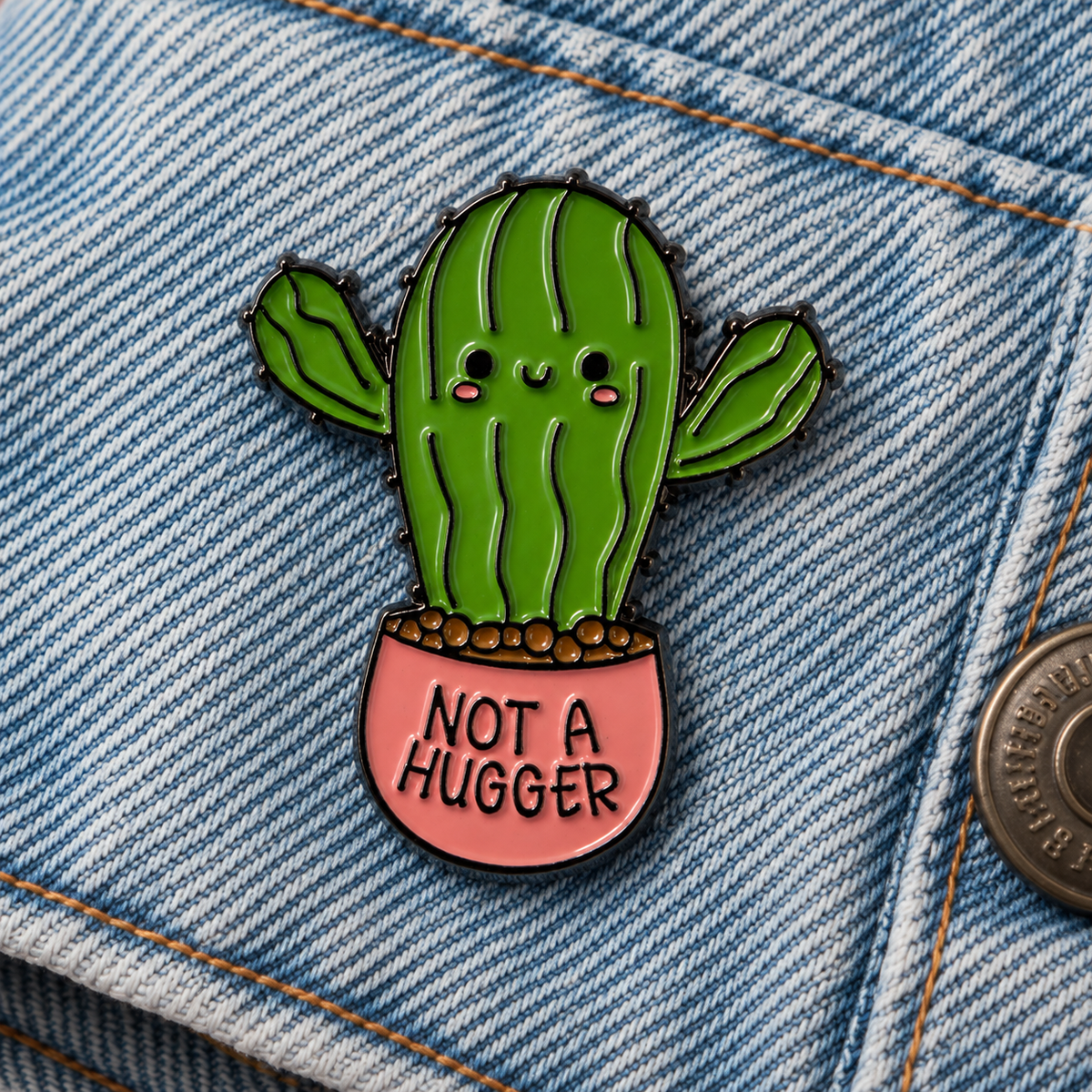 Not a Hugger cactus enamel pin close up