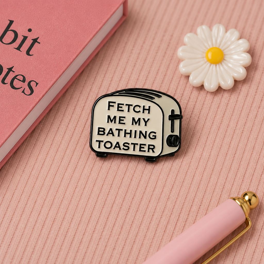 Fetch Me My Bathing Toaster enamel pin flatlay