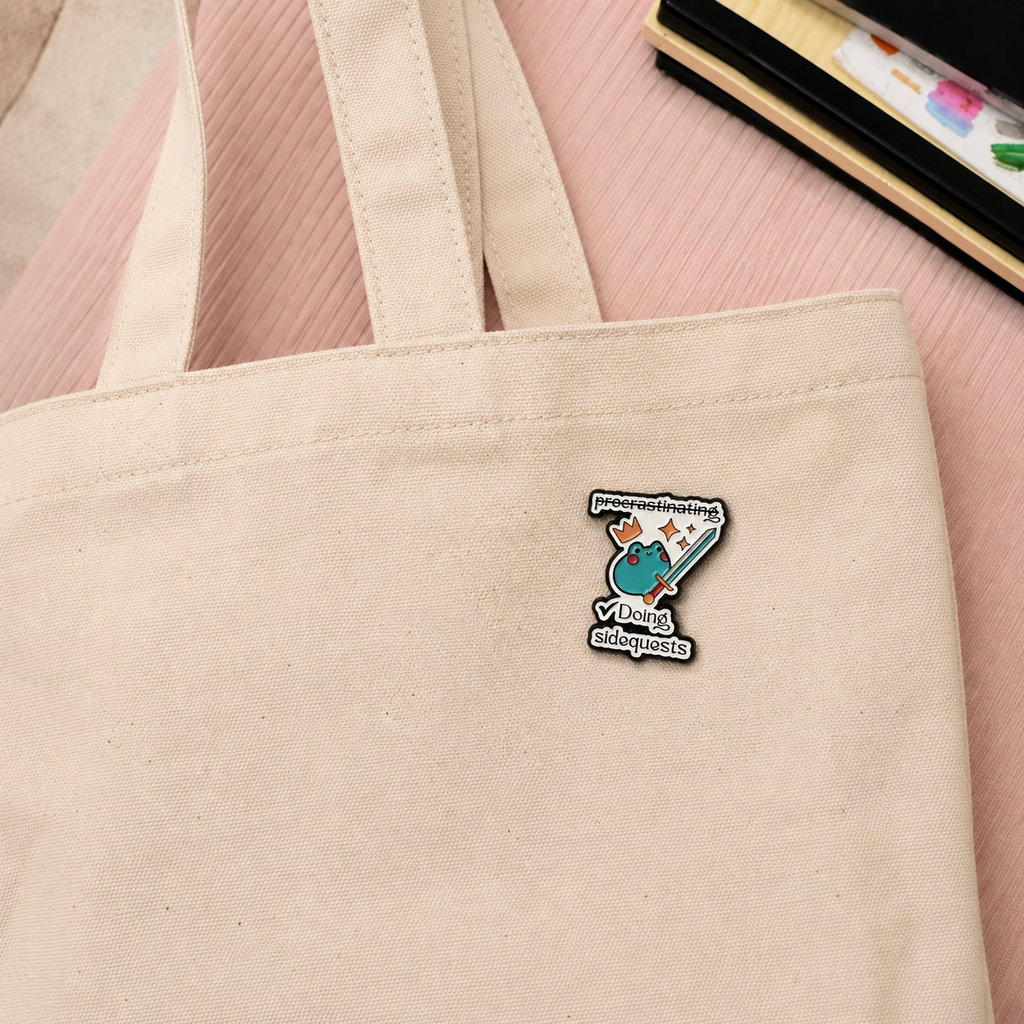 Doing Sidequests frog enamel pin on tote bag