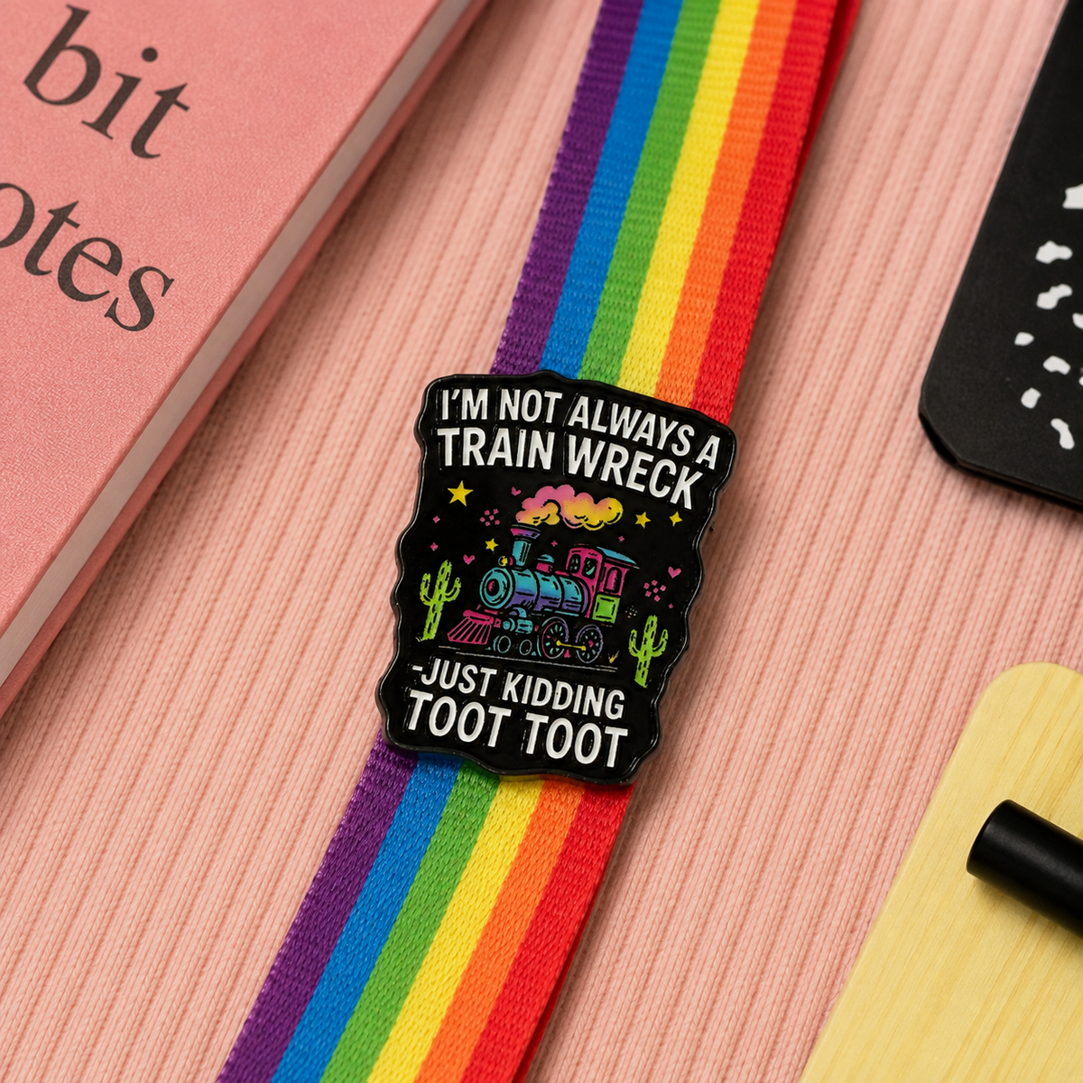 Toot Toot train wreck enamel pin on rainbow lanyard