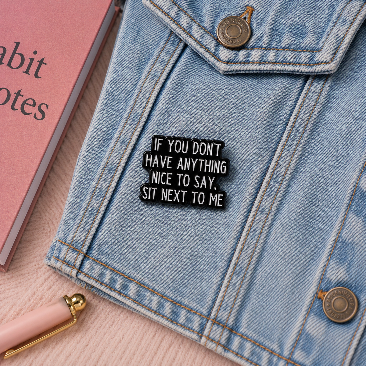 Sit Next To Me enamel pin on denim jacket