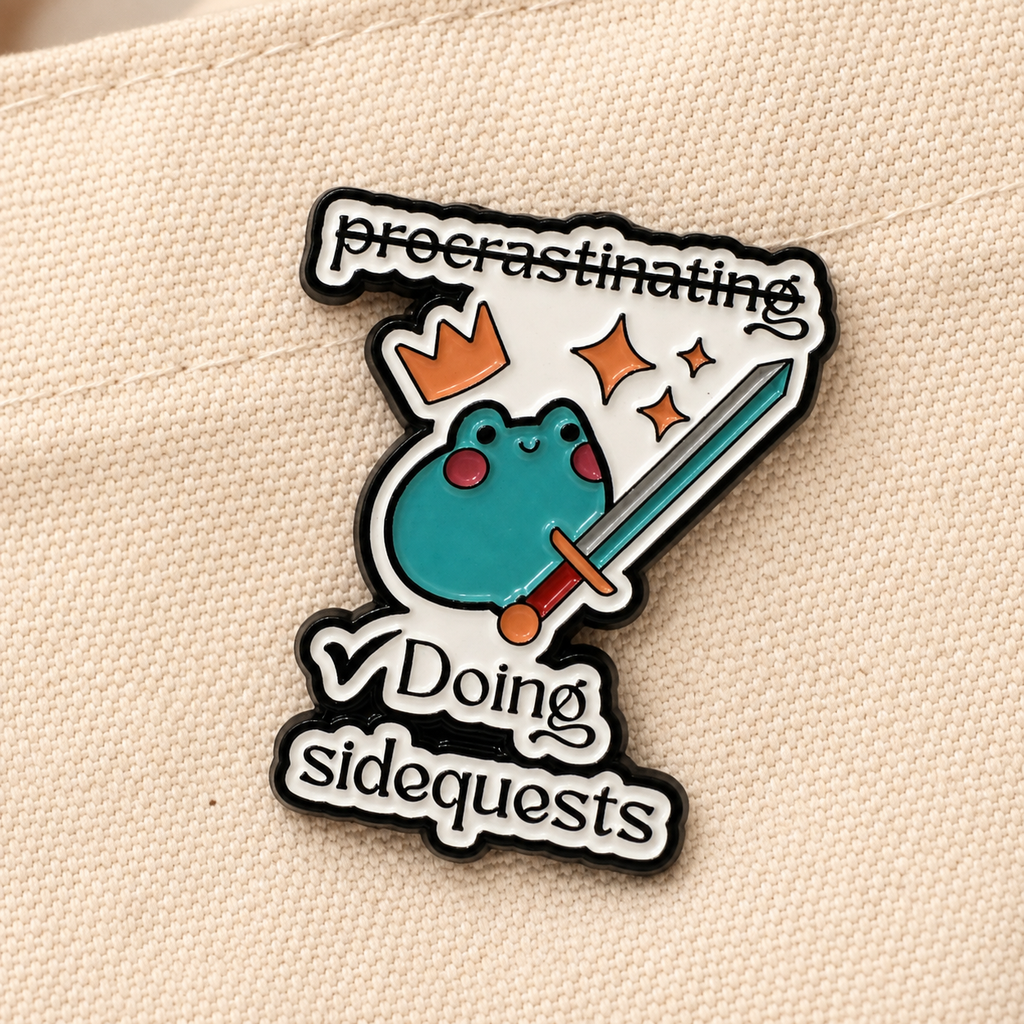 Doing Sidequests frog enamel pin close up
