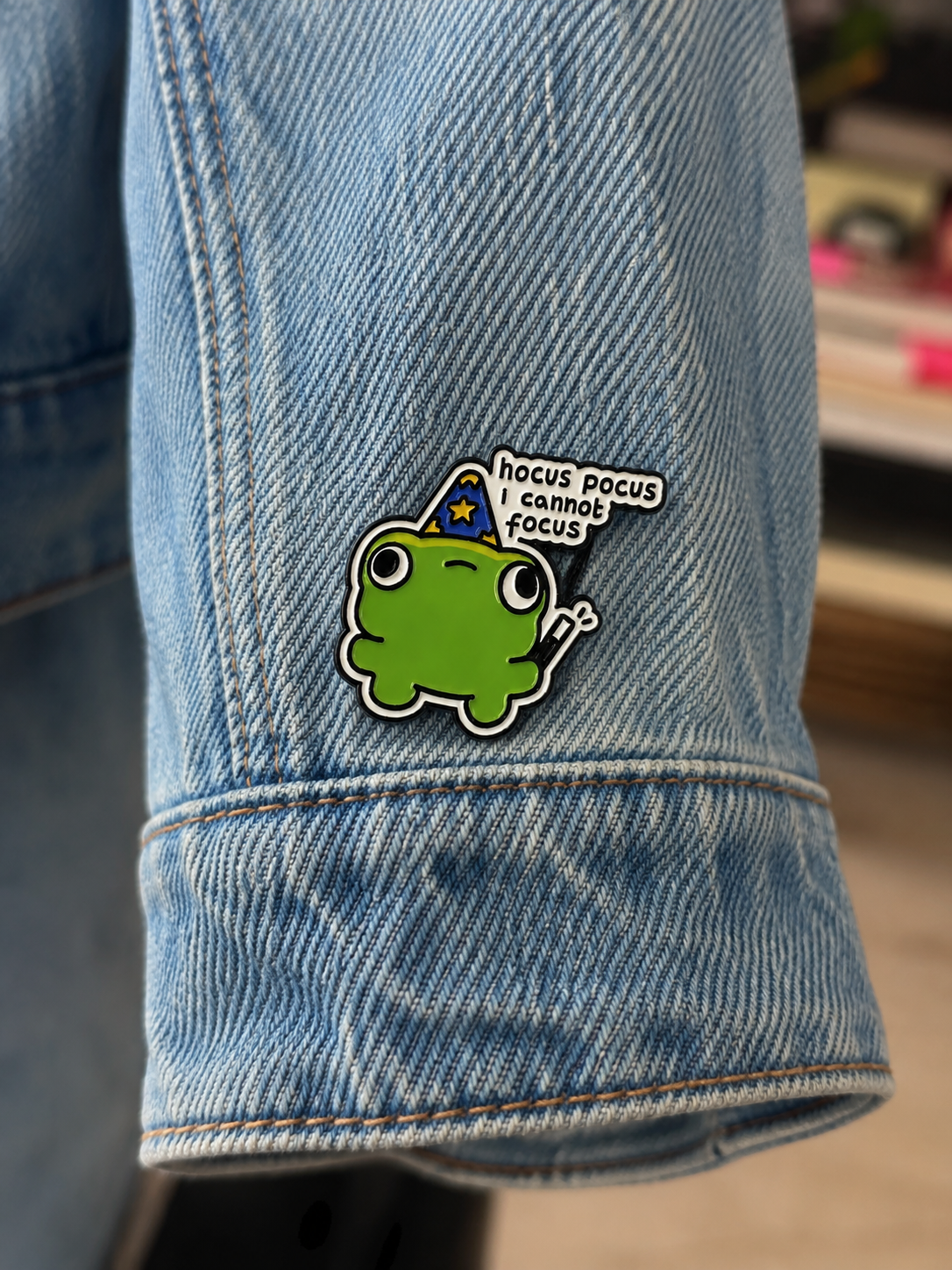 Hocus Pocus I Cannot Focus frog enamel pin on denim